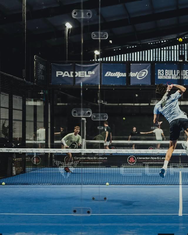 Tournament match under lights, crowd watching