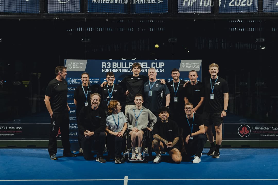 Tournament staff and team on court after an event